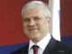 Boris Tadi� is the son of Ljubomir Tadi�, a philosopher and a member of Serbian Academy of Sciences and Arts and Nevenka Tadi�, a psychologist. He was born in Sarajevo, People's Republic of Bosnia and Herzegovina (then People's Federal Republic of Yugoslavia). His grandparents were killed during World War II, by Ustashas in the Independent State of Croatia because of their Serbian origin, and are considered victims of the Holocaust.

He attended elementary and high school in Belgrade and graduated in Clinical Psychology of Social Psychology at the University of Belgrade Faculty of Philosophy. He worked as a journalist, clinical psychologist, taught psychology at the First Belgrade Gymnasium and was a researcher of science projects on the Institute for Psychology. He worked actively in the democrat opposition, for which he was imprisoned more than on one occasion.

He founded and was the first Director of the Center for the Development of Democracy and Political Skills and for the past few years he is working on political enlightenment for the peoples of Serbia, Republika Srpska, Republic of Macedonia and Bulgaria.


[edit] Political career
Tadi� has been a member of the Democratic Party since its founding in 1990, performing several roles within the party including Secretary of the General Committee and Vice-President of the Executive Board of the Party. He was also an MP in the National Assembly of the Republic of Serbia during Milosevic's rule, as a member its Committee for Science and technology.

On the 27 February 2000 gathering of the Democratic Party, he was elected Vice-President of the Party.

In 2002 he became Minister of Telecommunications in the Government of the Federal Republic of Yugoslavia; later he was Minister of Defence in the Council of Ministers of Serbia and Montenegro.

In 2003 he was elected as a Representative to the Assembly of Serbia and Montenegro and became Acting Head of the Group of Democratic Party Representatives. In 2004 he was elected as a Head-Representative of his party to the National Assembly of Serbia. Later in this year, he was elected President of Democratic Party, one year after the assassination of the former party president, Zoran �in�i�.

In the first round of the Serbian presidential election, 2004 he won 27.3% of the vote. In the second round, on 27 June 2004, he defeated Tomislav Nikoli� with 53.24% of the vote.


[edit] Presidency
 


This article is part of the series:
Republic of Serbia
 
History 
of Vojvodina | of Kosovo 
Politics 
of Vojvodina | of Kosovo
Government
National Assembly
President: Boris Tadi�
Prime Minister: Vojislav Ko�tunica
Constitution of Serbia
Political parties
Elections:
  2006 constitutional referendum
  2003-2007 parliamentary
  2004 presidential
Foreign relations
Military
Subdivisions
  Districts
  Municipalities

 
Economy 
Communications
Transportation
National Bank
 
Culture 
Religion
Music
 
Geography 
Demographics
Mountains
Rivers
Cities
Places A-M | N-Z

 
 
See also: Portal:Politics

view � talk � edit 
He was officially sworn in as the president at a ceremony in Belgrade on 11 July 2004.

Tadi� is the first Serbian head of state that has met officially with the Pope. This meeting occurred during the official trip of the President to Vatican on 28 September 2005, where he met Pope Benedict XVI.

Boris Tadi� was the first president to visit Montenegro after the independence referendum in 2006. He had met with the Montenegrin President and Prime Minister and expressed will for mutual cooperation and friendship between the two independent countries.

He raised the flag of Serbia in front of the UN General Assembly building in New York City, after the Union of Serbia and Montenegro ceased to exist.

One of the main promises Tadi� made prior to the elections, was the opening of the National Office of the President (Narodna Kancelarija Predsednika) which would help out people in trouble. He fulfilled his promise, and the office proved to be a successful project as a very active institution which helped many people with their varied problems.

During the ceremony marking the 50th anniversary of the Hungarian Revolution of 1956 in October 2006, Boris Tadi� together with Ferenc Gyurcs�ny, the prime minister of Hungary, revealed a memorial plaque placed at the entrance of Serbian embassy, dedicated to Imre Nagy.


[edit] Security issues
On 1 December 2004, Tadi�s presidential motorcade was involved in a traffic accident. Miroslav Cimpl, a Serbian employee of the US Embassy, refused to make way for the motorcade and crashed repeatedly into the vehicles in it, though the president�s car was not affected. The employee managed to flee, but after reporting the incident to his employer, the US Embassy, he was subsequently arrested.

This incident petrified the general public because it evoked memories of a failed attempt at assassinating Zoran �in�i� in February 2003, when a truck driven by Zemun clan member Dejan Bagzi Milenkovi� crashed into �in�i�'s motorcade on an open highway. Many at first believed this second incident to be an attempt to assassinate Tadi�, but a subsequent police investigation found no evidence to support this claim.

Minister of Police Dragan Jo�i� said during a press conference that Cimpl got confused when he saw the flashing lights of the motorcade and did not know what to do. The police concluded that it was only a traffic accident and that there was no intention to harm the President. Cimpl stayed in jail for two weeks, before being released (see (Halifax), (B92)).


[edit] Personal life
Besides his native language, Tadi� also speaks English and French. He is married and the father of two children.

