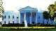 Foto : The White House is the official residence and principal workplace of the president of the United States. Located at 1600 Pennsylvania Avenue NW in Washington, D.C., the house was designed by Irish-born James Hoban,[1] and built between 1792 and 1800 of white-painted Aquia sandstone in the Neoclassical style. It has been the residence of every U.S. president since John Adams. When Thomas Jefferson moved into the house in 1801, he (with architect Benjamin Henry Latrobe) expanded the building outward, creating two colonnades that were meant to conceal stables and storage.[2]
 
In 1814, during the War of 1812, the mansion was set ablaze by the British Army in the Burning of Washington, destroying the interior and charring much of the exterior. Reconstruction began almost immediately, and President James Monroe moved into the partially reconstructed house in October 1817. Construction continued with the addition of the South Portico in 1824 and the North in 1829. Because of crowding within the executive mansion itself, President Theodore Roosevelt had all work offices relocated to the newly constructed West Wing in 1901. Eight years later, President William Howard Taft expanded the West Wing and created the first Oval Office which was eventually moved as the section was expanded. The third-floor attic was converted to living quarters in 1927 by augmenting the existing hip roof with long shed dormers. A newly constructed East Wing was used as a reception area for social events; Jefferson's colonnades connected the new wings. East Wing alterations were completed in 1946, creating additional office space. By 1948, the house's load-bearing exterior walls and internal wood beams were found to be close to failure. Under Harry S. Truman, the interior rooms were completely dismantled and a new internal load-bearing steel frame constructed inside the walls. Once this work was completed, the interior rooms were rebuilt.
 
Today, the White House Complex includes the Executive Residence, West Wing, Cabinet Room, Roosevelt Room, East Wing, and the Eisenhower Executive Office Building, which houses the executive offices of the President and Vice President.
 
The White House is made up of six stories�the Ground Floor, State Floor, Second Floor, and Third Floor, as well as a two-story basement. The term White House is regularly used as a metonym for the Executive Office of the President of the United States and for the president's administration and advisers in general. The property is a National Heritage Site owned by the National Park Service and is part of the President's Park. In 2007, it was ranked second on the American Institute of Architects list of 